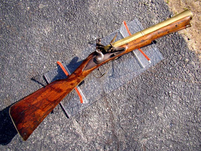 An English Queen Anne period  brass barreled flintlock sea service blunderbuss by Thomas Green dated 1708.